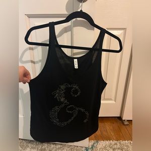 BELLA CANVAS | loose fitting, lightweight cropped tank w/an and symbol on front